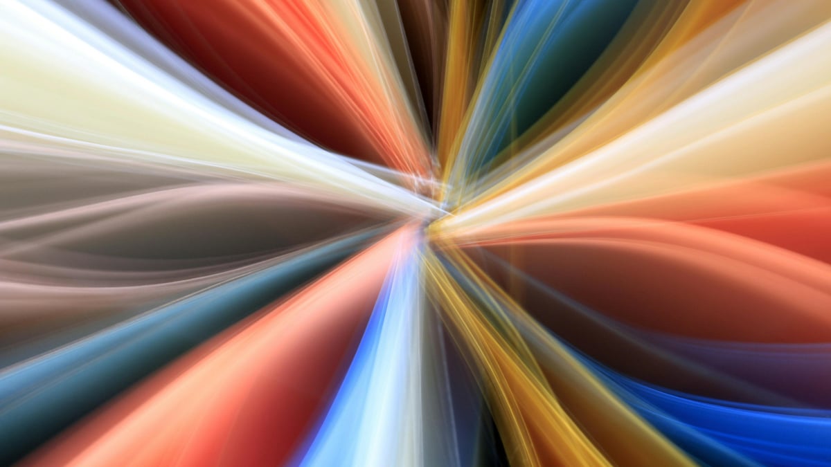 Abstract vibrant light streaks radiating outward representing creative refresh and amplified ad performance